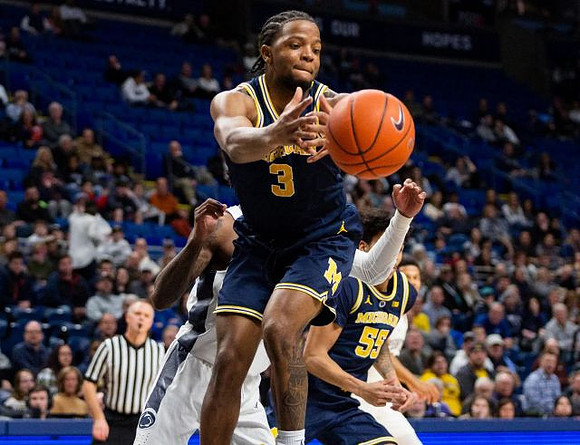 Zavier Simpson (3) and Eli Brooks (55)