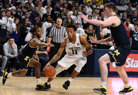 Zavier Simpson (3) and Jon Teske (15)