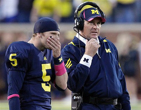 Tate Forcier (5) and Rich Rodriguez