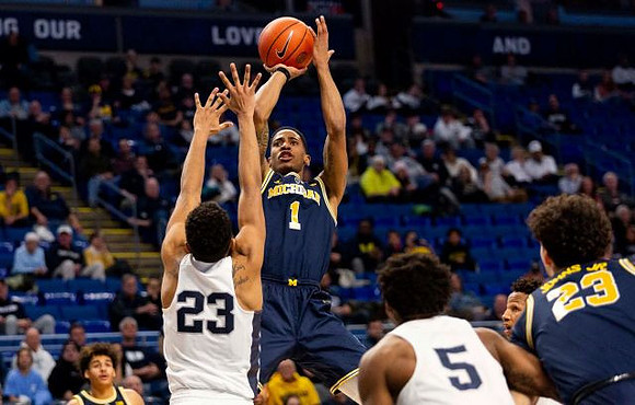 Charles Matthews (1) and Brandon Johns Jr. (23)
