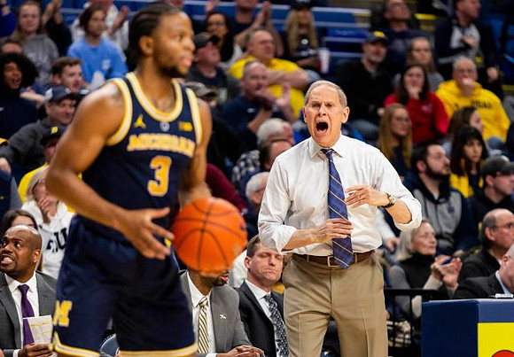 Zavier Simpson (3) and John Beilein