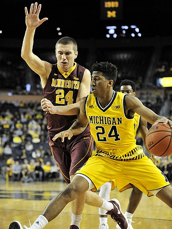 Aubrey Dawkins (24) and Derrick Walton Jr. (10)