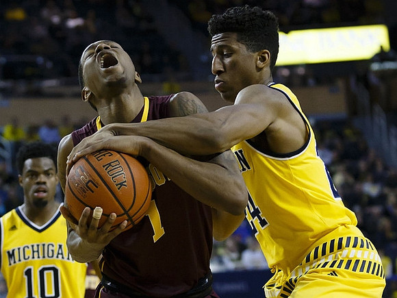 Derrick Walton Jr. (10) and Aubrey Dawkins (24)