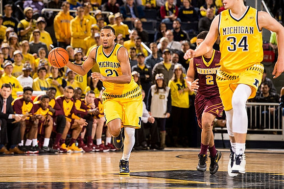 Zak Irvin (21) and Mark Donnal (34)