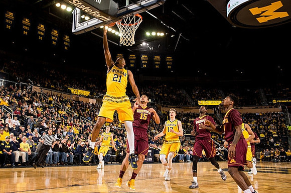 Zak Irvin (21), Duncan Robinson (22), and Moritz Wagner (13)