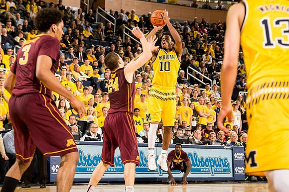 Derrick Walton Jr. (10) and Moritz Wagner (13)