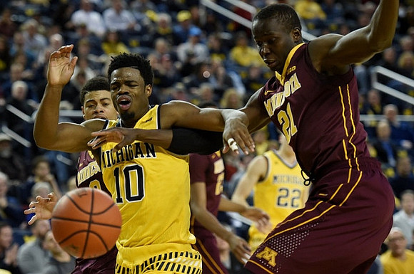 Derrick Walton Jr. (10) and Duncan Robinson (22)