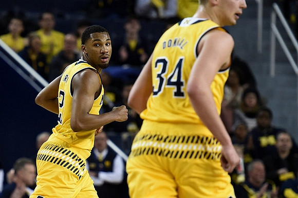 Zak Irvin (21) and Mark Donnal (34)