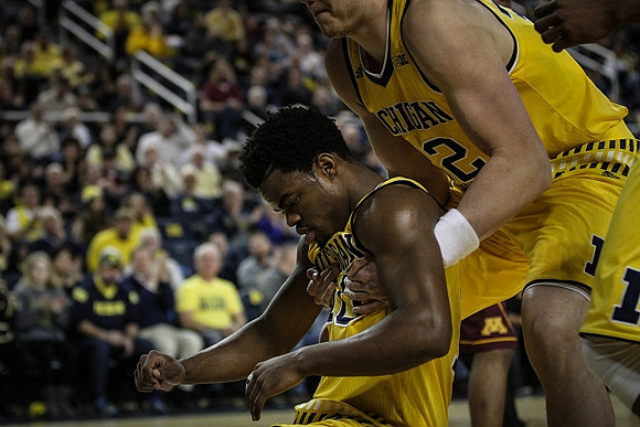 Derrick Walton Jr. (10) and Ricky Doyle (32)