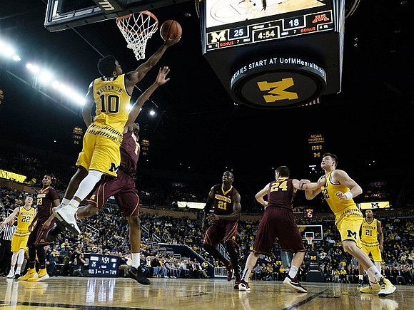 Duncan Robinson (22), Derrick Walton Jr. (10), Ricky Doyle (32), and Zak Irvin (21)