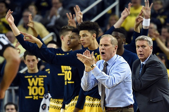 Andrew Dakich (11), Kameron Chatman (3), D.J. Wilson (5), John Beilein, and Jeff Meyer