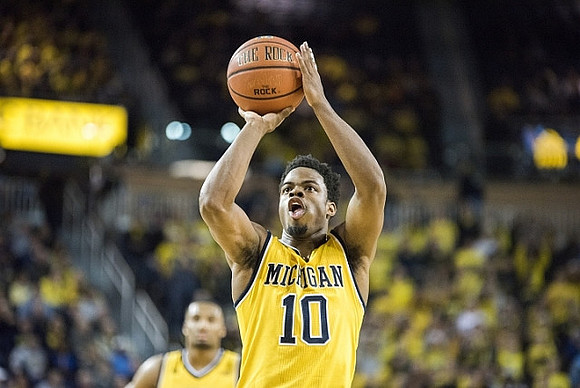 Derrick Walton Jr. (10) and Zak Irvin (21)