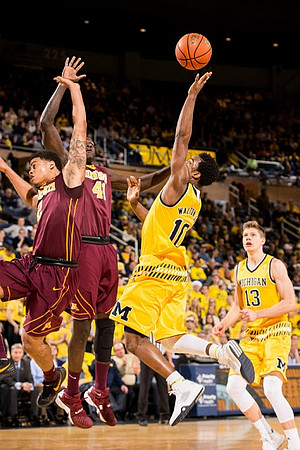 Derrick Walton Jr. (10) and Moritz Wagner (13)