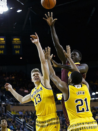 Aubrey Dawkins (24), Moritz Wagner (13), and Zak Irvin (21)