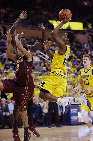 Derrick Walton Jr. (10) and Moritz Wagner (13)