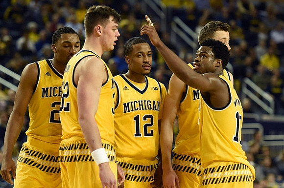 Zak Irvin (21), Ricky Doyle (32), Muhammad-Ali Abdur-Rahkman (12), Duncan Robinson (22), and Derrick Walton Jr. (10)