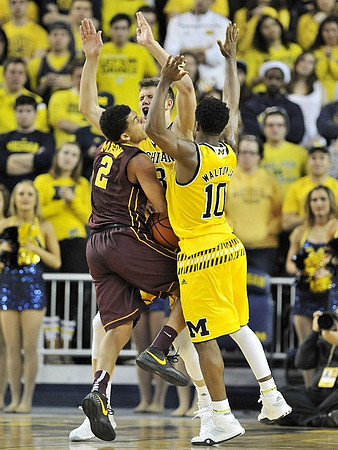 Moritz Wagner (13) and Derrick Walton Jr. (10)