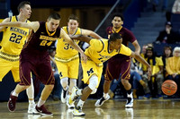 Duncan Robinson (22), Mark Donnal (34), and Muhammad-Ali Abdur-Rahkman (12)