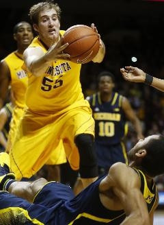 Derrick Walton Jr. (10) and Jon Horford (15)