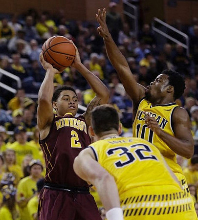 Ricky Doyle (32) and Derrick Walton Jr. (10)