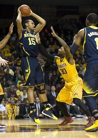 Jon Horford (15) and Glenn Robinson III (1)