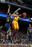 Jon Horford (15) and Derrick Walton Jr. (10)