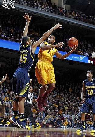 Jon Horford (15) and Derrick Walton Jr. (10)