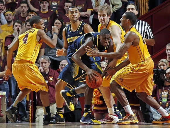 Jon Horford (15) and Caris LeVert (23)
