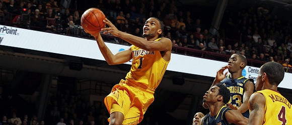 Derrick Walton Jr. (10) and Caris LeVert (23)