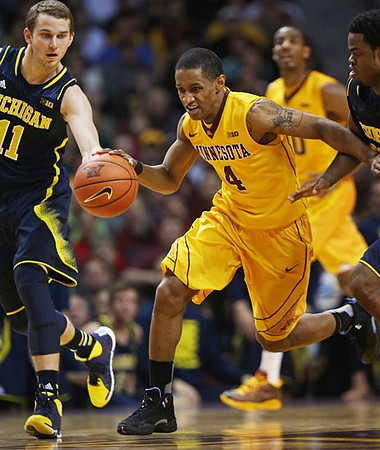 Nik Stauskas (11) and Derrick Walton Jr. (10)