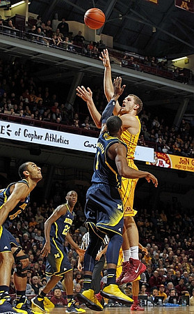 Jon Horford (15), Caris LeVert (23), and Glenn Robinson III (1)
