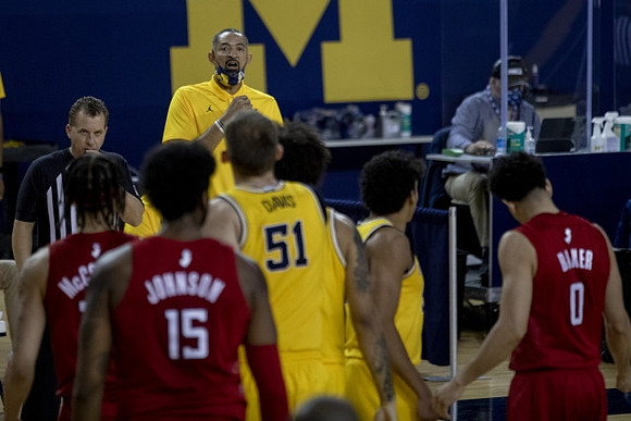 Austin Davis (51), Eli Brooks (55), and Juwan Howard