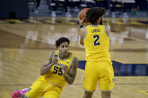 Eli Brooks (55) and Isaiah Livers (2)