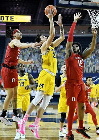 Chaundee Brown Jr. (15), Brandon Johns Jr. (23), and Austin Davis (51)