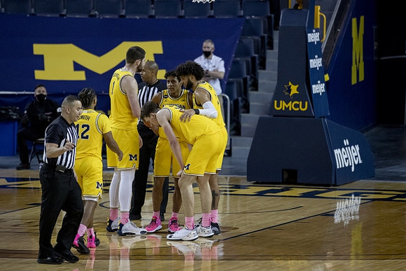 Mike Smith (12), Hunter Dickinson (1), Eli Brooks (55), Franz Wagner (21), and Isaiah Livers (2)