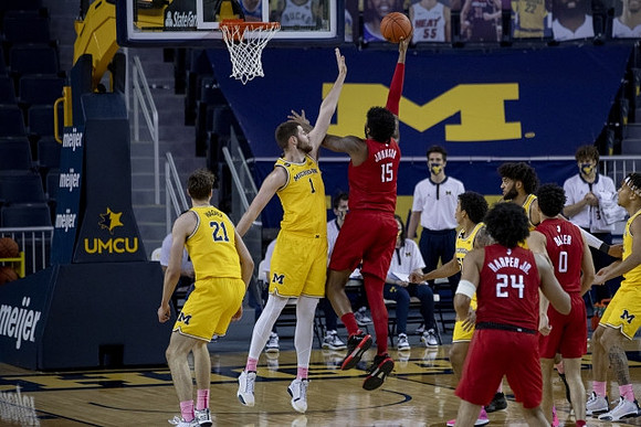 Franz Wagner (21), Hunter Dickinson (1), Eli Brooks (55), Isaiah Livers (2), and Terrance Williams II (5)
