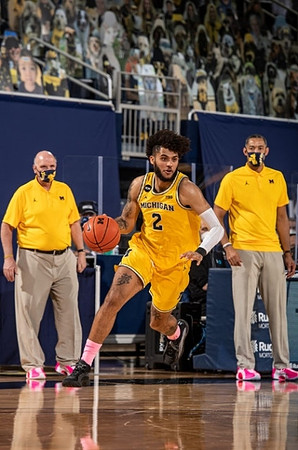 Isaiah Livers (2), Phil Martelli, and Juwan Howard