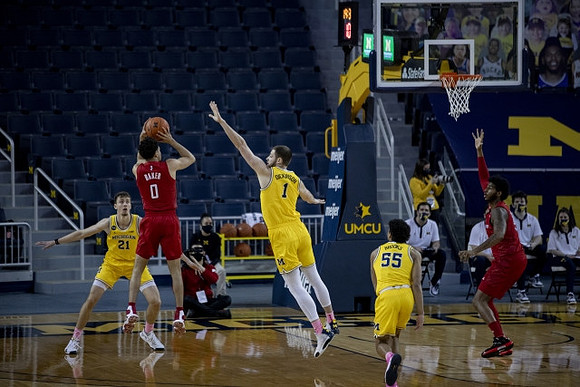 Franz Wagner (21), Hunter Dickinson (1), and Eli Brooks (55)