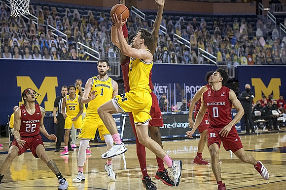 Eli Brooks (55), Hunter Dickinson (1), and Franz Wagner (21)