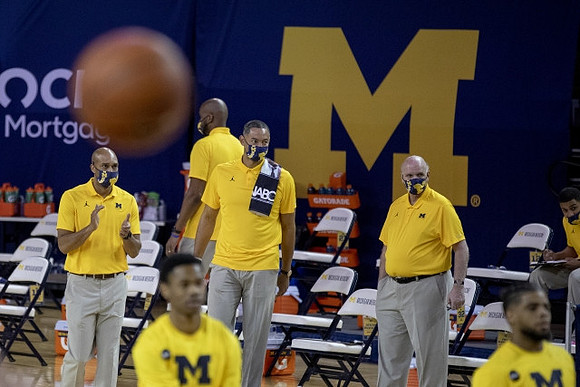 Saddi Washington, Juwan Howard, and Phil Martelli