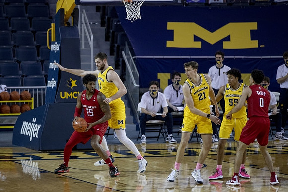 Hunter Dickinson (1), Franz Wagner (21), and Eli Brooks (55)