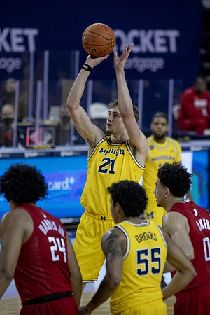 Franz Wagner (21), Eli Brooks (55), and Mike Smith (12)