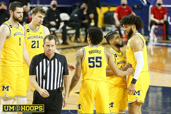Hunter Dickinson (1), Franz Wagner (21), Eli Brooks (55), Mike Smith (12), and Isaiah Livers (2)