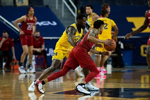 Chaundee Brown Jr. (15), Mike Smith (12), and Brandon Johns Jr. (23)