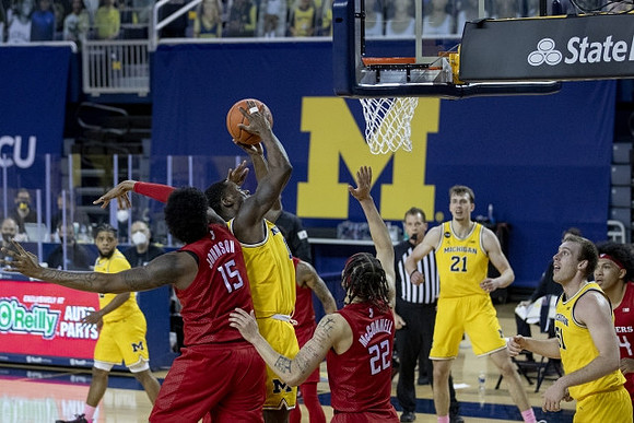 Mike Smith (12), Chaundee Brown Jr. (15), Franz Wagner (21), and Austin Davis (51)
