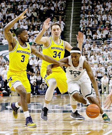 Xavier Simpson (3) and Mark Donnal (34)
