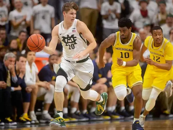 Derrick Walton Jr. (10) and Muhammad-Ali Abdur-Rahkman (12)