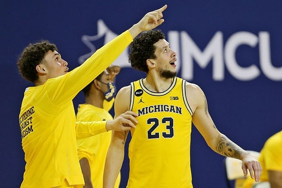 Adrien Nunez (0) and Brandon Johns Jr. (23)