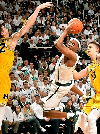 Duncan Robinson (22) and Moritz Wagner (13)
