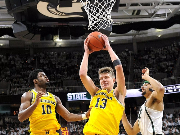 Derrick Walton Jr. (10) and Moritz Wagner (13)